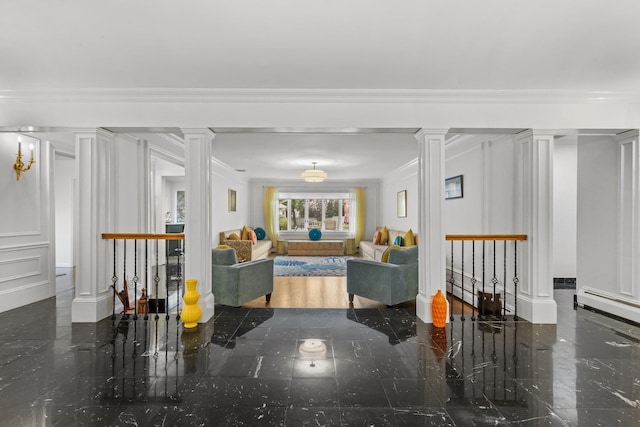 187 Jackson Ave, Pelham, NY 10803 - living area featuring a decorative wall, ornamental molding, granite finish floor, and ornate columns