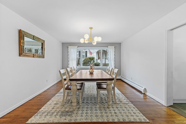 187 Jackson Ave, Pelham, NY 10803 - dining space featuring a baseboard heating unit, an inviting chandelier, dark wood-type flooring, and baseboards