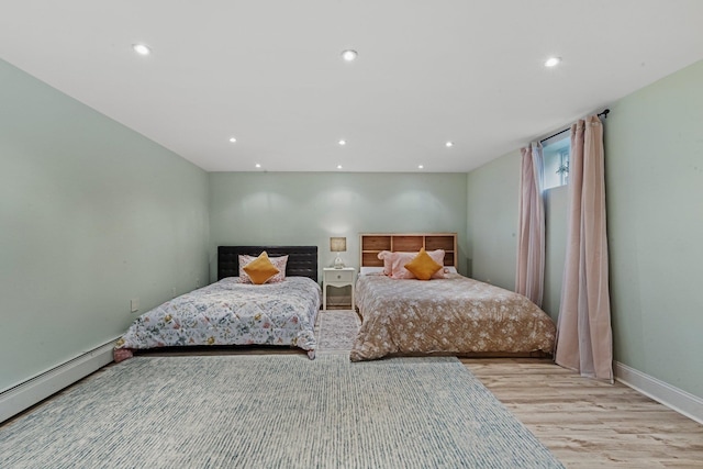 187 Jackson Ave, Pelham, NY 10803 - bedroom with light wood-type flooring, baseboard heating, baseboards, and recessed lighting