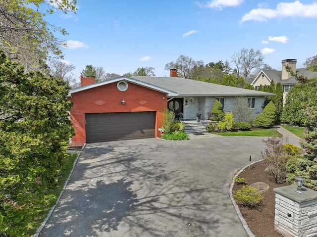 187 Jackson Ave, Pelham, NY 10803 - ranch-style house featuring an attached garage, driveway, a chimney, and brick siding