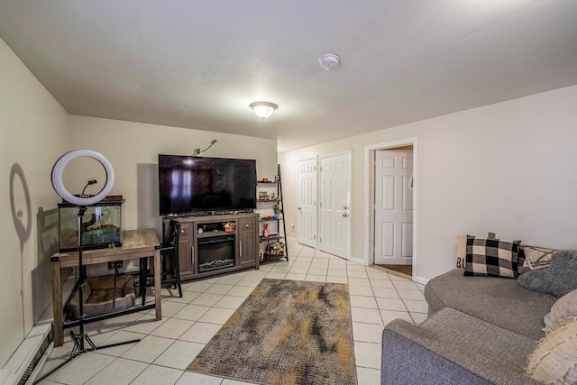 living room with light tile patterned floors and baseboards