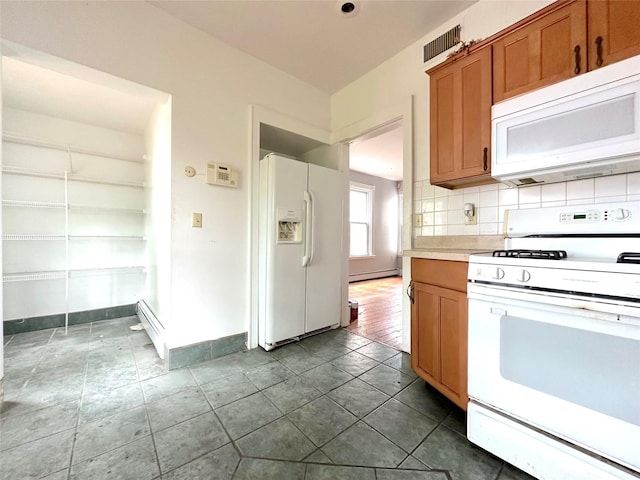 kitchen featuring light countertops, white appliances, brown cabinets, backsplash, and a baseboard heating unit