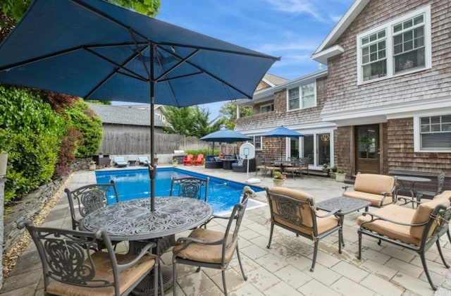 8 Hilltop Dr, Bayville, NY 11709 - view of pool featuring a fenced in pool, a patio, outdoor dining area, an outdoor hangout area, and fence