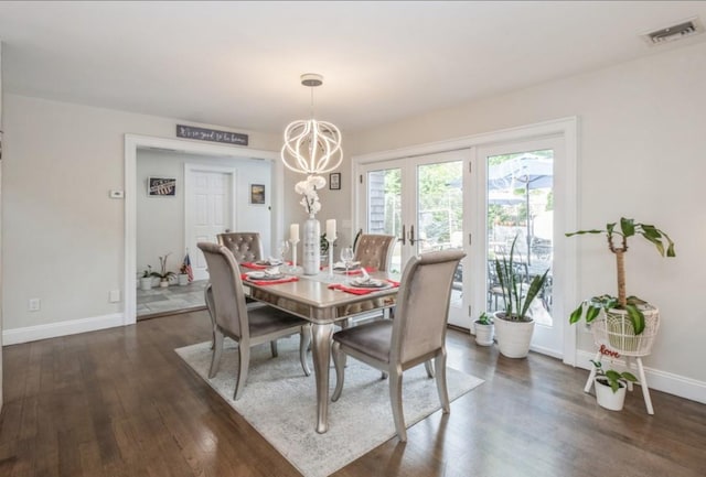 8 Hilltop Dr, Bayville, NY 11709 - dining area featuring dark wood-style flooring, visible vents, baseboards, and an inviting chandelier