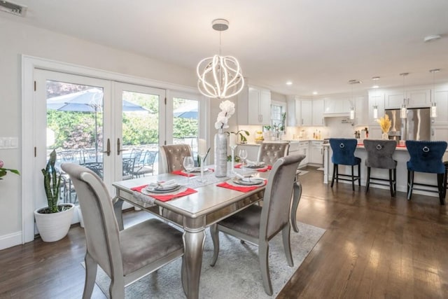 8 Hilltop Dr, Bayville, NY 11709 - dining space featuring french doors, visible vents, an inviting chandelier, and dark wood-style floors