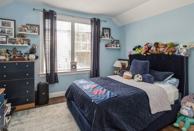 8 Hilltop Dr, Bayville, NY 11709 - bedroom featuring wood finished floors, baseboards, multiple windows, and lofted ceiling