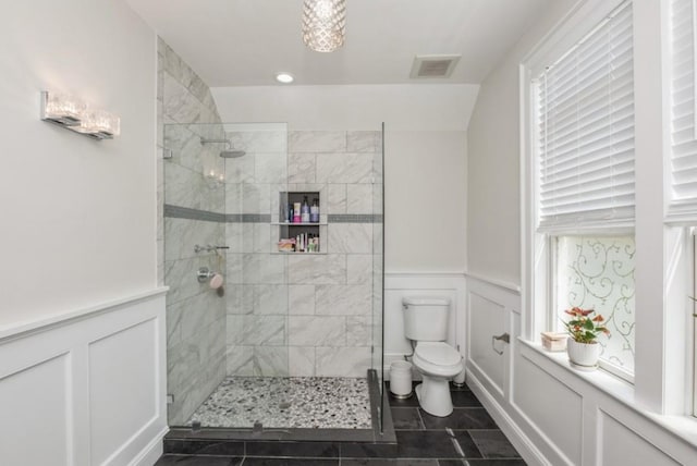 8 Hilltop Dr, Bayville, NY 11709 - full bath with toilet, visible vents, a tile shower, and a decorative wall