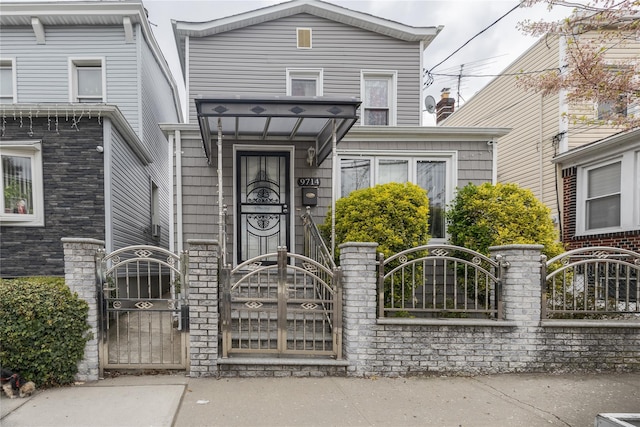 97-14 88th St, Ozone Park, NY 11416 - doorway to property featuring a gate and fence