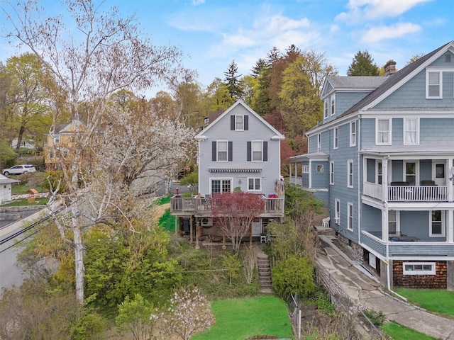 2 Palmer Ave, Croton-On-Hudson, NY 10520 - rear view of house featuring a chimney and a deck