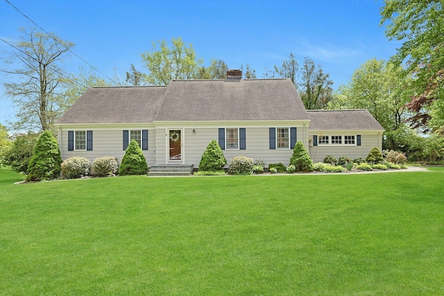 12 Heath Rd, Valhalla, NY 10595 - view of front facade with a chimney and a front yard
