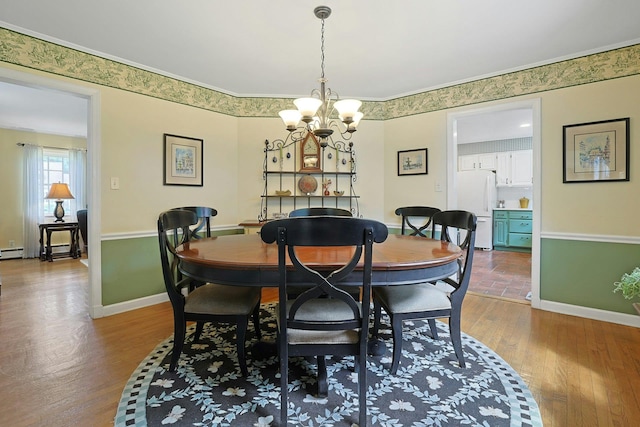 12 Heath Rd, Valhalla, NY 10595 - dining space with wood finished floors, a chandelier, and baseboards