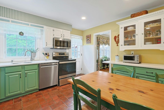 12 Heath Rd, Valhalla, NY 10595 - kitchen featuring appliances with stainless steel finishes, a sink, light countertops, white cabinets, and recessed lighting