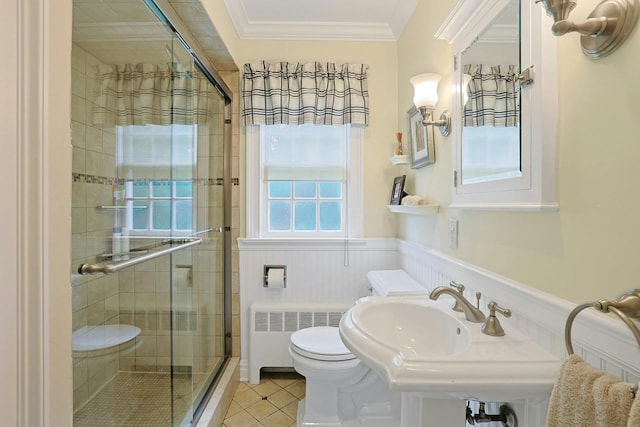 12 Heath Rd, Valhalla, NY 10595 - bathroom featuring radiator, a stall shower, toilet, a wainscoted wall, and tile patterned flooring