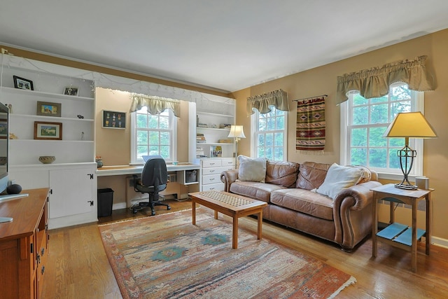 12 Heath Rd, Valhalla, NY 10595 - living area featuring plenty of natural light, wood finished floors, and an office area