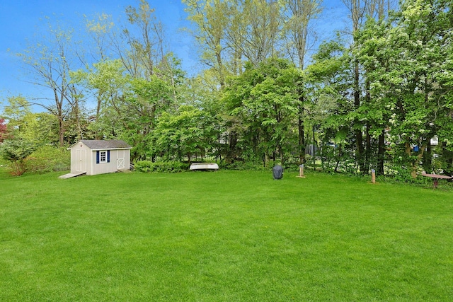 12 Heath Rd, Valhalla, NY 10595 - view of grassy yard featuring a storage unit and an outbuilding