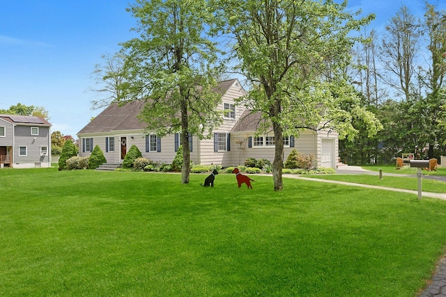 12 Heath Rd, Valhalla, NY 10595 - view of front facade featuring a front yard, a garage, and driveway