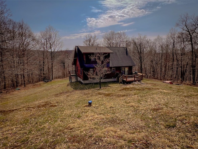 exterior space with a yard and a wooden deck