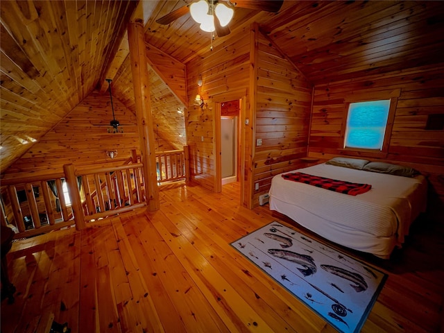unfurnished bedroom with wooden ceiling, a ceiling fan, wooden walls, vaulted ceiling, and wood-type flooring