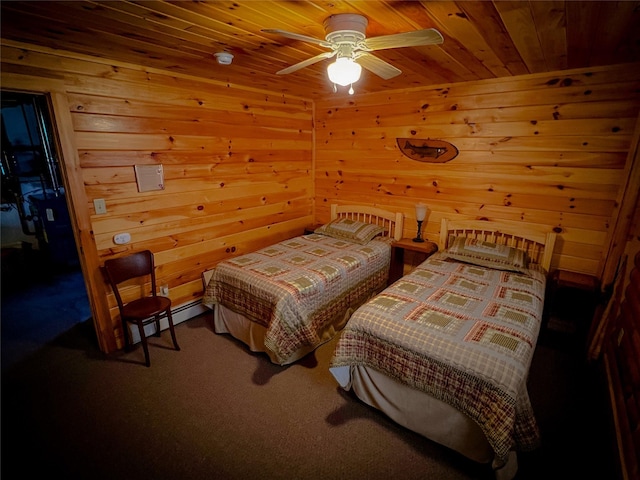 carpeted bedroom with wooden walls, wood ceiling, and a ceiling fan