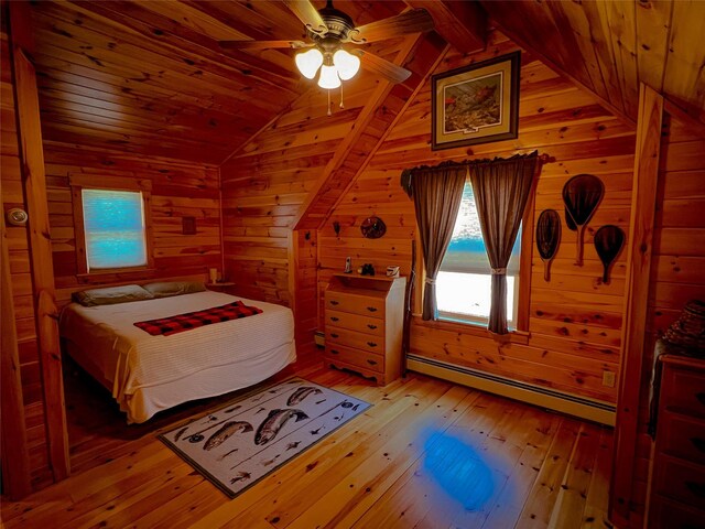 607 Baker Hill Rd, Roscoe, NY 12776 - bedroom with baseboard heating, wooden walls, light wood-type flooring, vaulted ceiling, and wooden ceiling