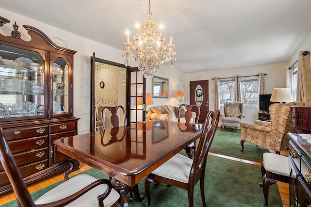 dining space with a notable chandelier