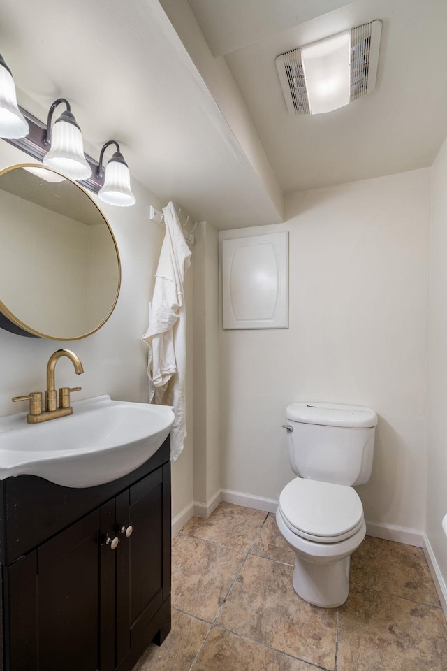 bathroom with baseboards, visible vents, toilet, and vanity