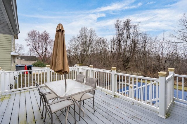 deck featuring outdoor dining area