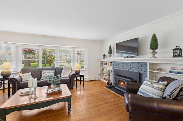 living room featuring a brick fireplace, baseboards, a baseboard radiator, ornamental molding, and light wood-style flooring