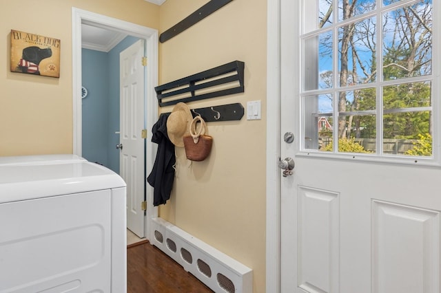 mudroom featuring crown molding, dark wood-style floors, and washer and clothes dryer
