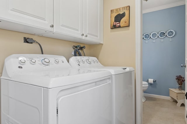 clothes washing area with separate washer and dryer, laundry area, baseboards, and ornamental molding