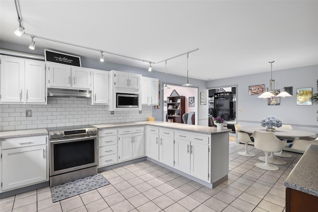 13 Cross Rd, Cortlandt Manor, NY 10567 - kitchen featuring stainless steel appliances, under cabinet range hood, rail lighting, and white cabinetry
