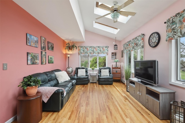 13 Cross Rd, Cortlandt Manor, NY 10567 - living room featuring a skylight, healthy amount of natural light, light wood-type flooring, and vaulted ceiling