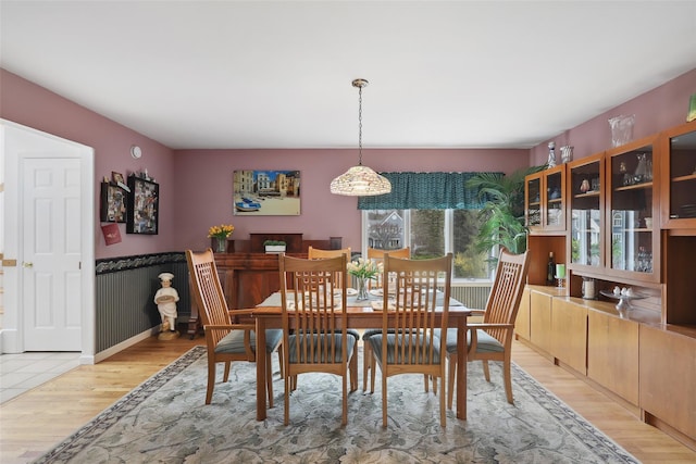 13 Cross Rd, Cortlandt Manor, NY 10567 - dining space with light wood-style floors and a wainscoted wall