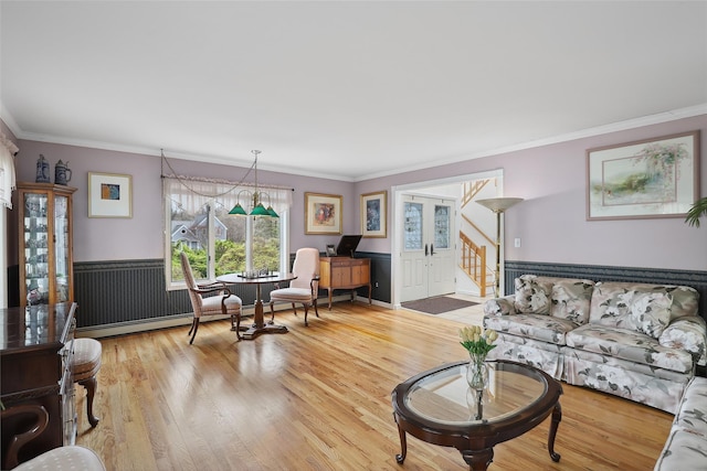 13 Cross Rd, Cortlandt Manor, NY 10567 - living area featuring ornamental molding, wood finished floors, wainscoting, and stairway