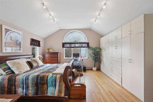 13 Cross Rd, Cortlandt Manor, NY 10567 - bedroom featuring track lighting, light wood finished floors, and vaulted ceiling