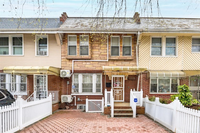 3518 Clarendon Rd, Brooklyn, NY 11203 - view of front of home with brick siding, roof with shingles, stone siding, and fence