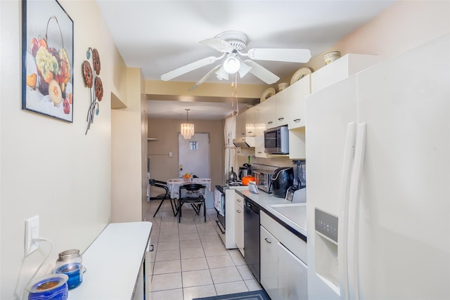 3518 Clarendon Rd, Brooklyn, NY 11203 - kitchen featuring stainless steel microwave, white cabinetry, black dishwasher, white refrigerator with ice dispenser, and light tile patterned floors