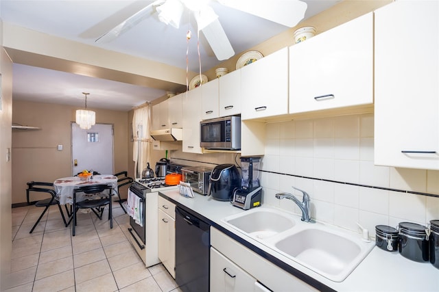 3518 Clarendon Rd, Brooklyn, NY 11203 - kitchen with range with gas cooktop, light tile patterned flooring, stainless steel microwave, under cabinet range hood, and black dishwasher