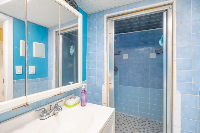 3518 Clarendon Rd, Brooklyn, NY 11203 - bathroom featuring tile walls, vanity, and a shower stall
