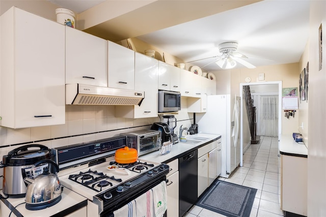 3518 Clarendon Rd, Brooklyn, NY 11203 - kitchen with under cabinet range hood, dishwasher, a sink, gas range oven, and stainless steel microwave