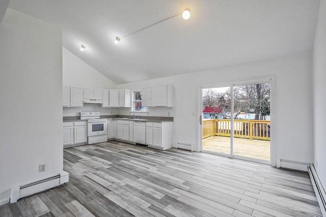 kitchen with a baseboard radiator, under cabinet range hood, and white appliances