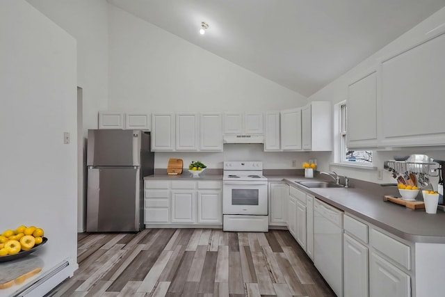 kitchen featuring a sink, white appliances, under cabinet range hood, high vaulted ceiling, and a baseboard heating unit