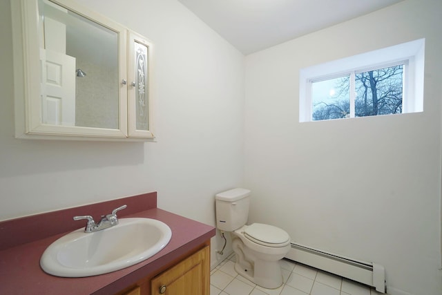 bathroom featuring vanity, toilet, tile patterned flooring, and baseboard heating
