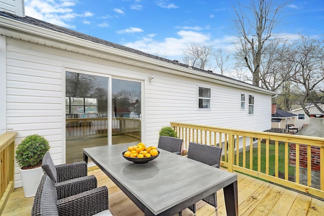 wooden deck featuring outdoor dining space