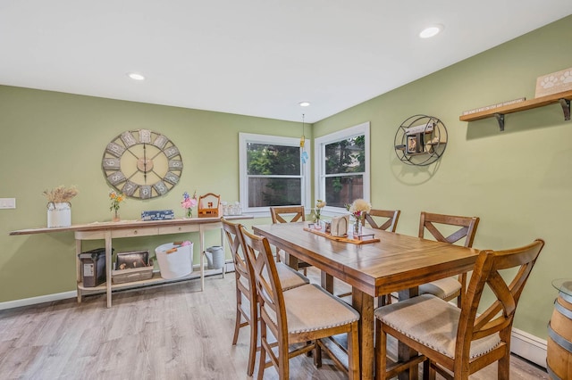 575 Bayport Ave, Bayport, NY 11705 - dining space with wood finished floors, a baseboard radiator, and recessed lighting