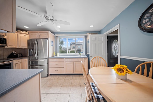 2 Lee Ave, Albertson, NY 11507 - kitchen featuring tasteful backsplash, ceiling fan, light brown cabinetry, stainless steel appliances, and light tile patterned flooring