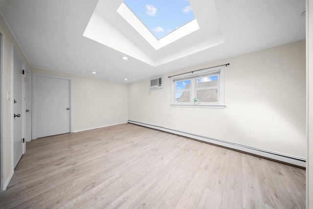 2 Lee Ave, Albertson, NY 11507 - unfurnished room featuring light wood-style floors, a wall unit AC, recessed lighting, a skylight, and a baseboard radiator