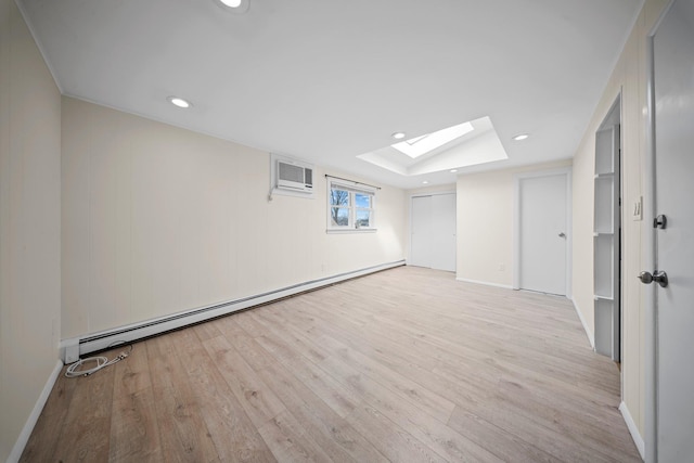 2 Lee Ave, Albertson, NY 11507 - basement with a wall mounted air conditioner, recessed lighting, a baseboard heating unit, and wood finished floors