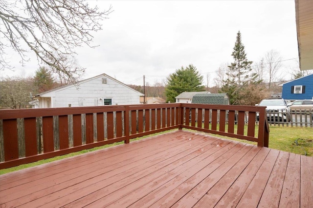 700 Sackett Lake Rd, Monticello, NY 12701 - wooden deck with an outbuilding and fence