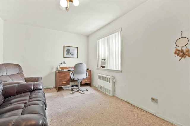 home office with radiator heating unit and carpet floors